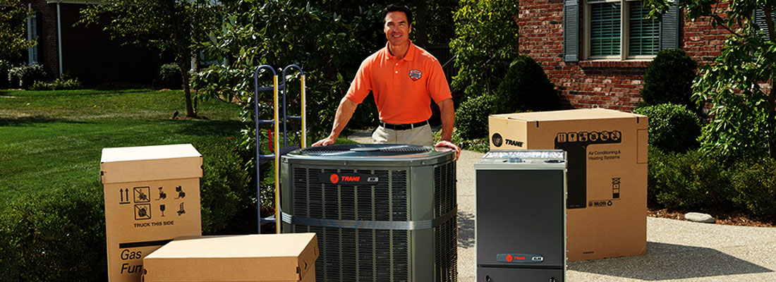 train dealer standing with trane products