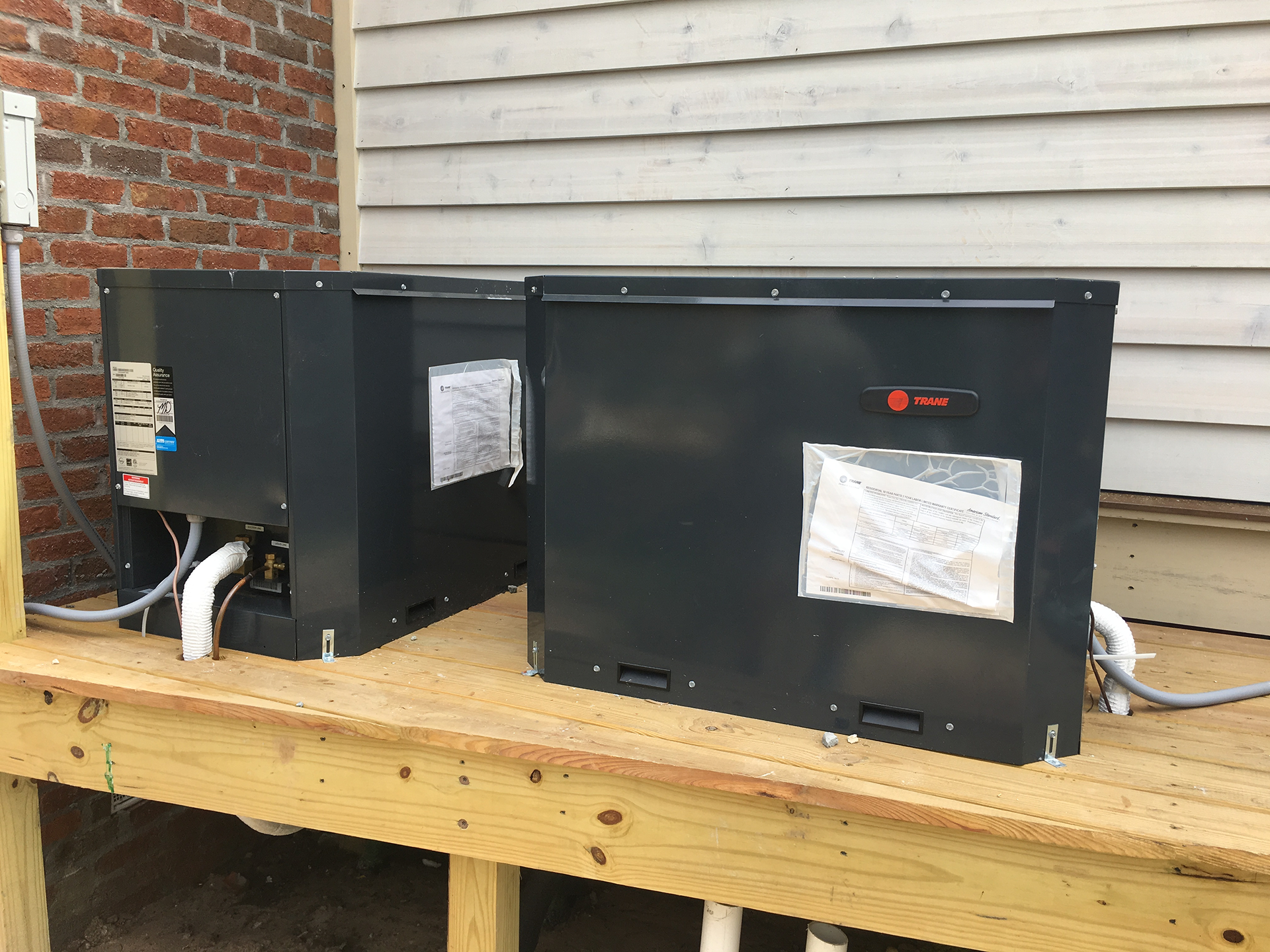 train dealer standing with trane products